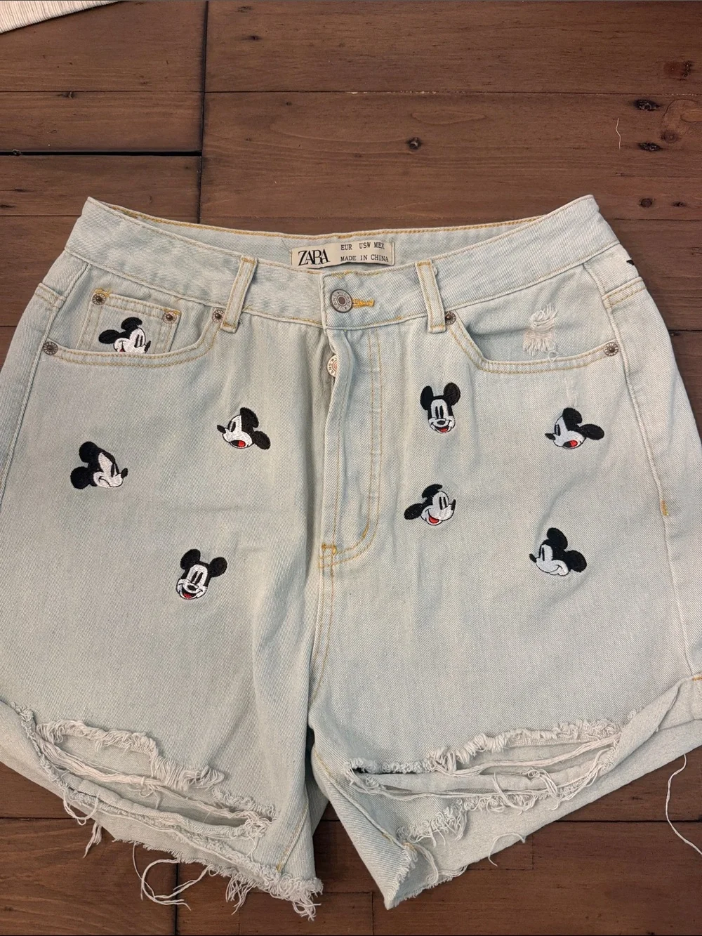 Zara distressed Mickey Mouse denim shorts